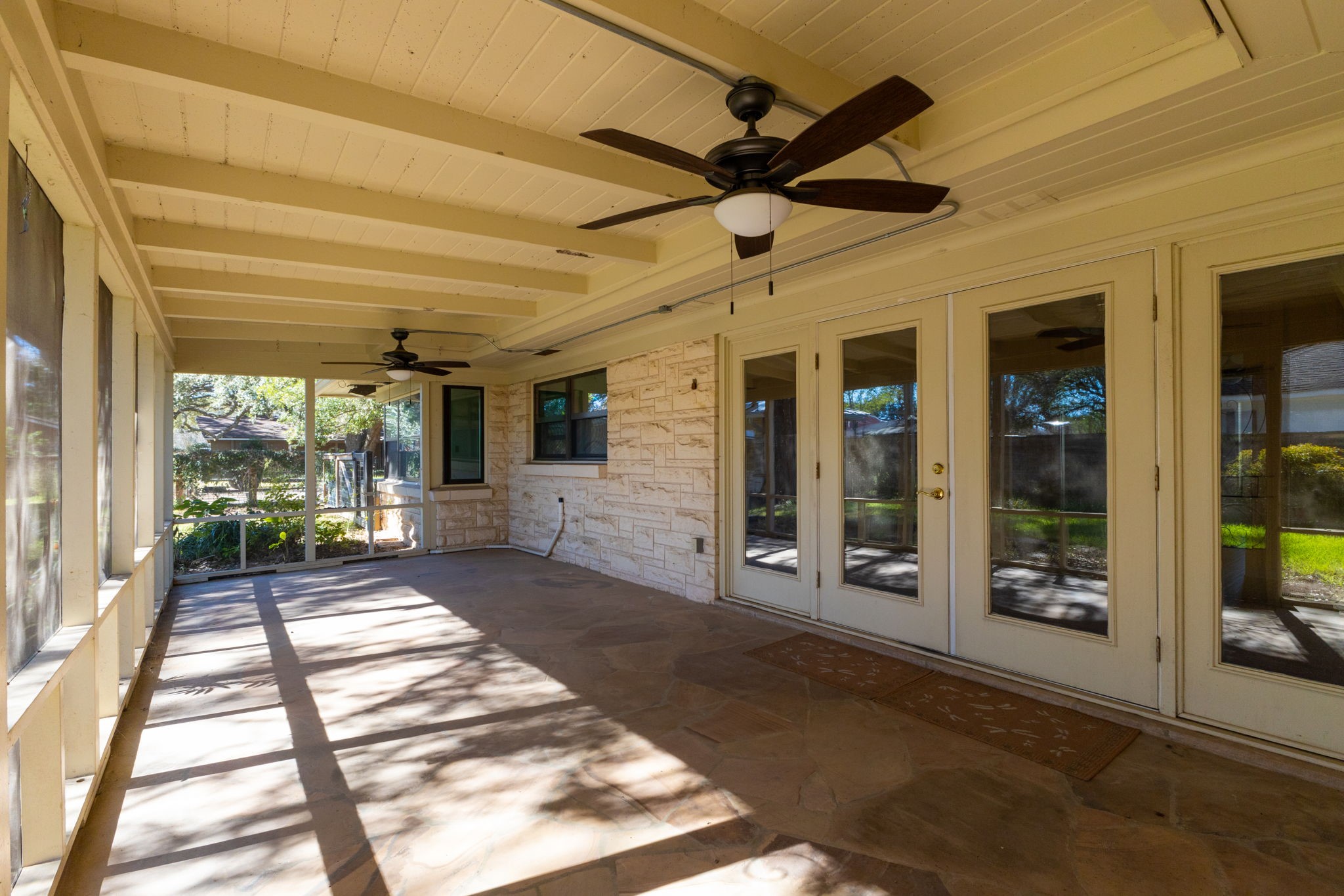 301 Bonham Street Columbus, TX 78934 - Photo 34 of 44 a view of a porch with a table and chairs