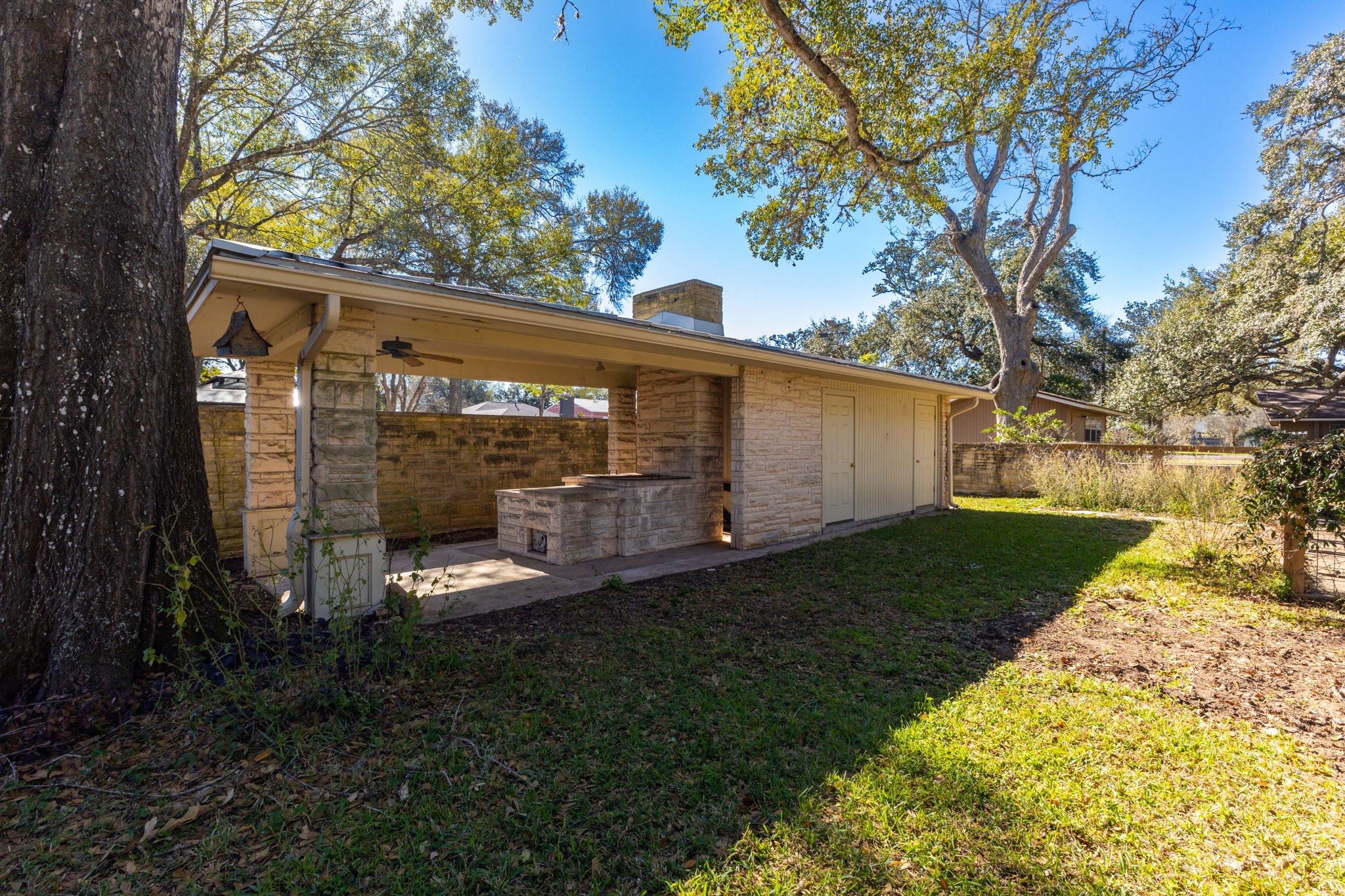 301 Bonham Street Columbus, TX 78934 - Photo 37 of 44 a view of a back yard with green space