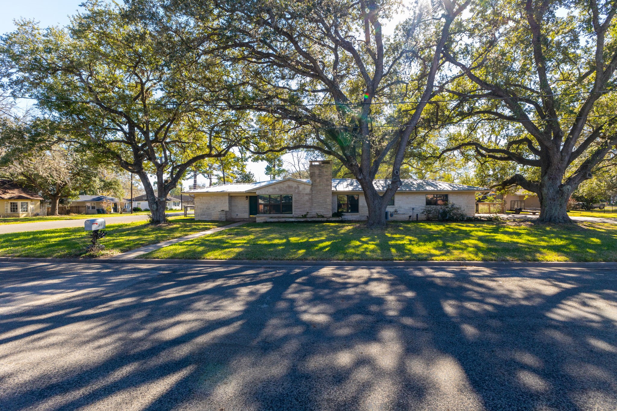 301 Bonham Street Columbus, TX 78934 - Photo 42 of 44 a view of a house with a big yard