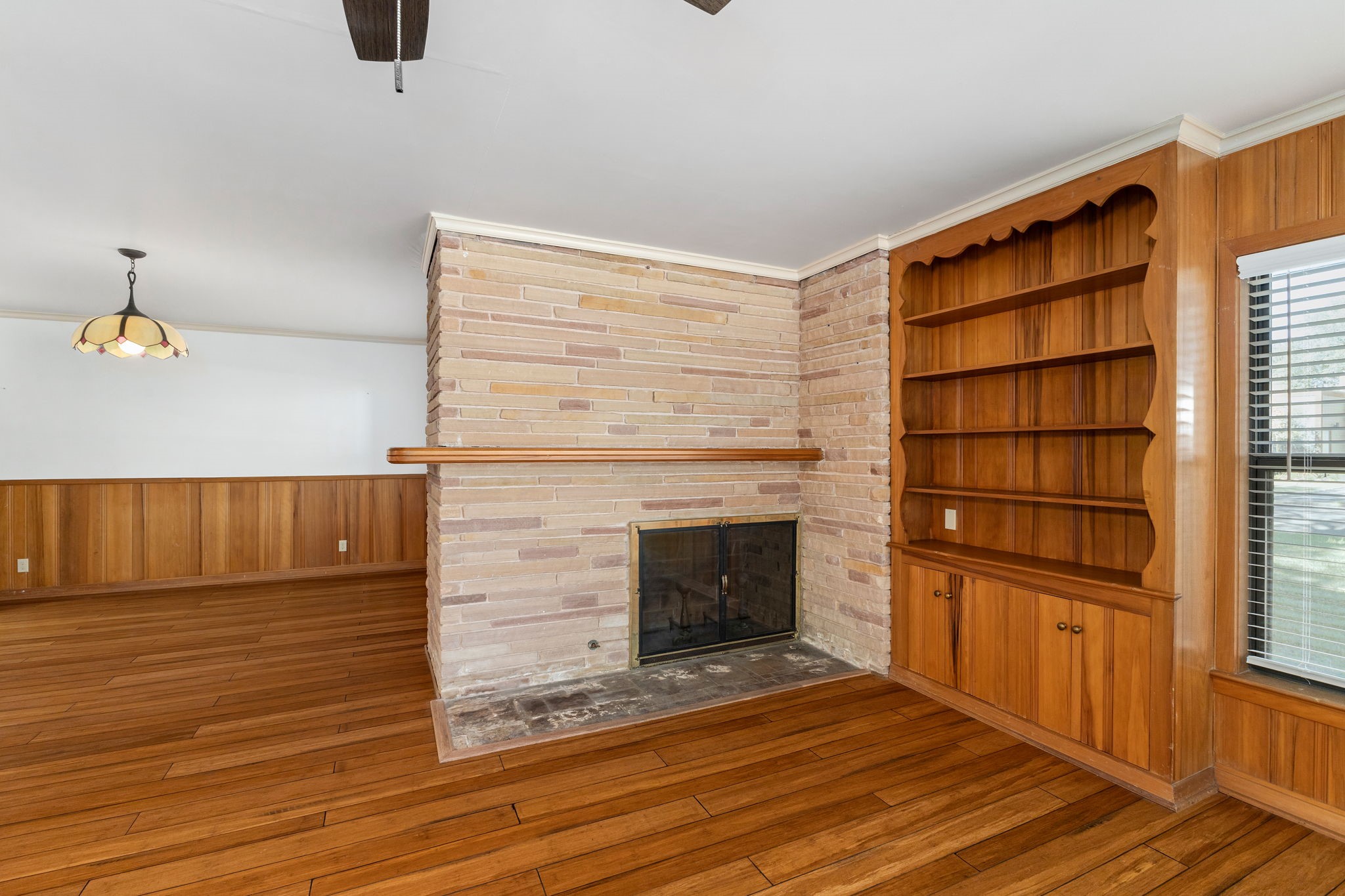 301 Bonham Street Columbus, TX 78934 - Photo 6 of 44 a view of empty room with wooden floor and fan