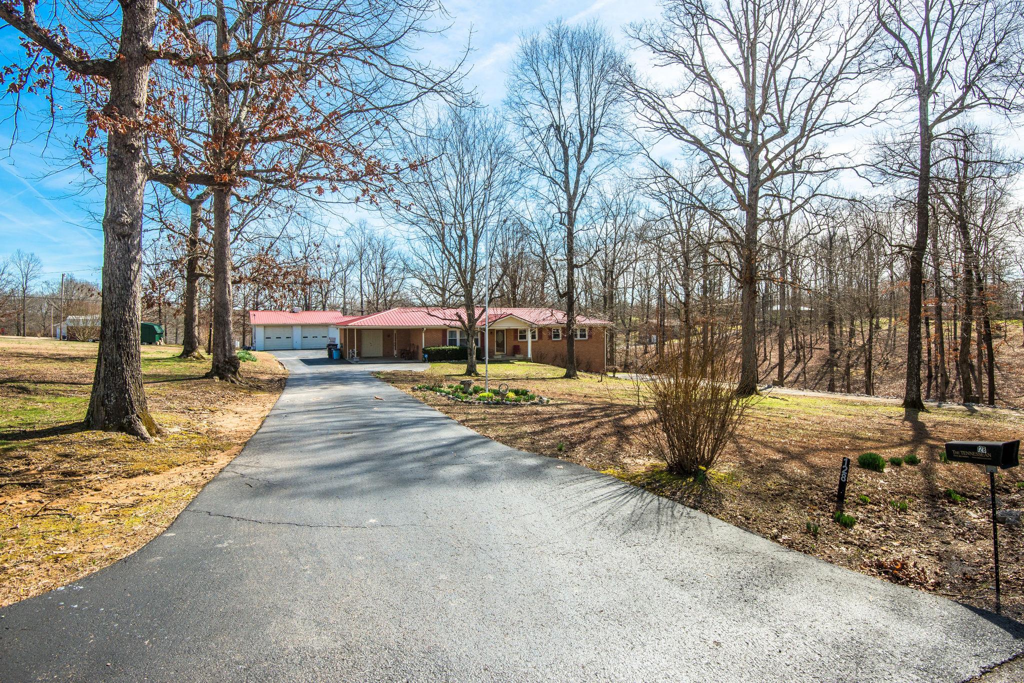 128 Robert Porter Road Dickson, TN 37055 - Photo 2 of 27 Concrete Drive w/ Covered Carport, 1 Car Basement Garage PLUS 2 Car Detached Garage!