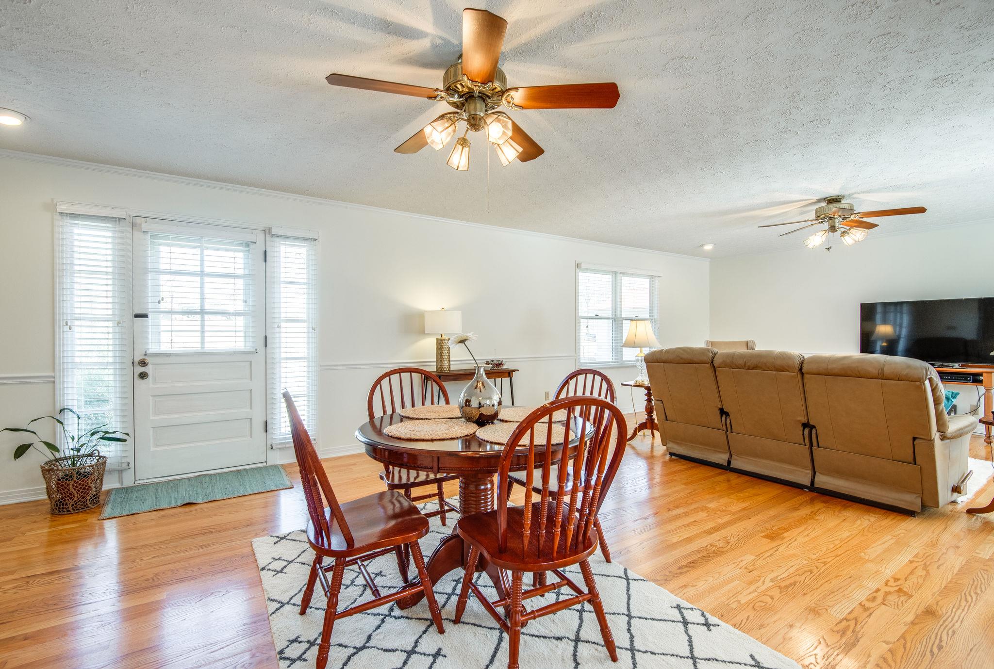 128 Robert Porter Road Dickson, TN 37055 - Photo 8 of 27 Great Room w/ Double Ceiling Fans & Access to Concrete Patio