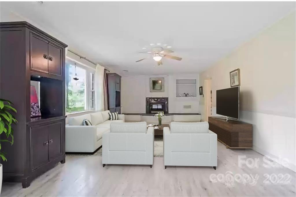 1024 Timber Lake Drive Charlotte, NC 28227 - Photo 9 of 34 a living room with furniture and a flat screen tv