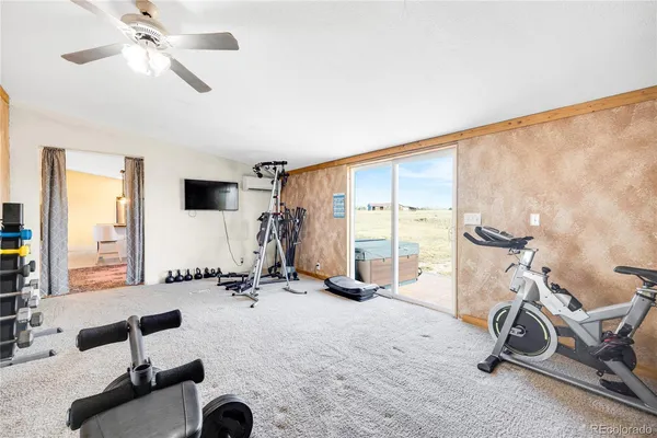 a view of a room with gym equipment