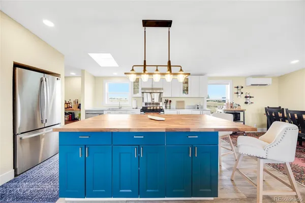 a kitchen with stainless steel appliances granite countertop a sink and cabinets