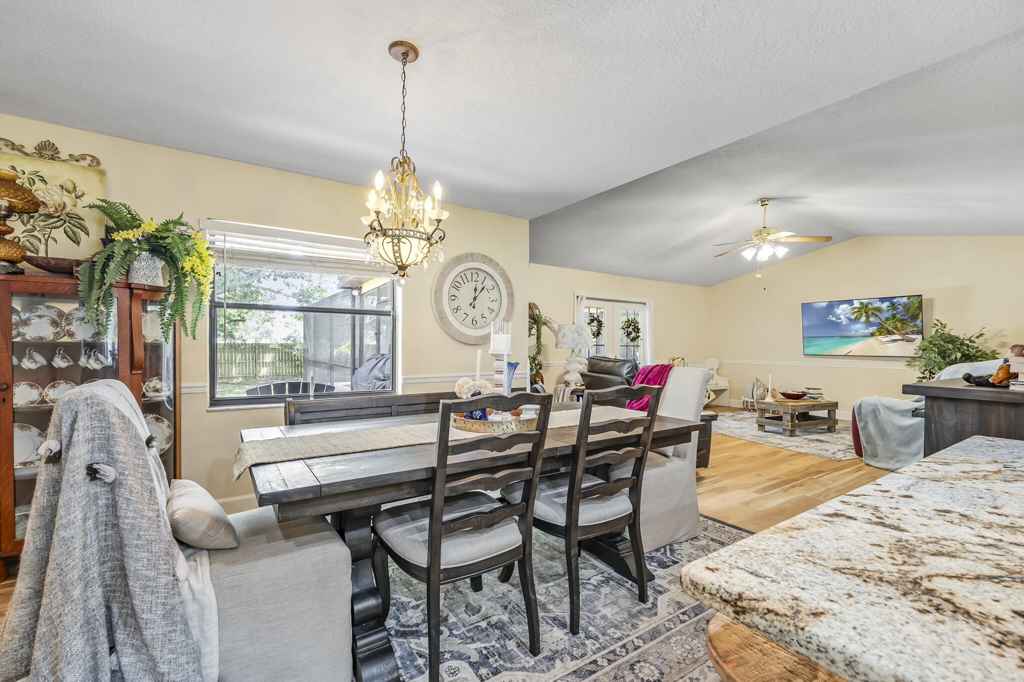 4650 Lake Washington Road Melbourne, FL 32934 - Photo 14 of 46 a view of a dining room with furniture and a chandelier