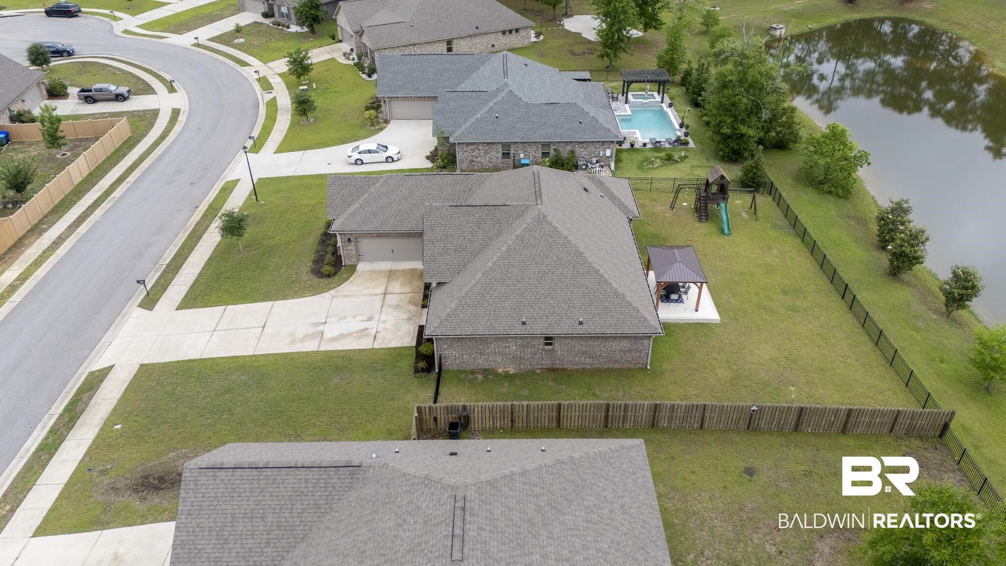 12672 Squirrel Drive Daphne, AL 36527 - Photo 44 of 49 Spacious corner lot featuring a private fenced backyard with a gazebo on a concrete patio
