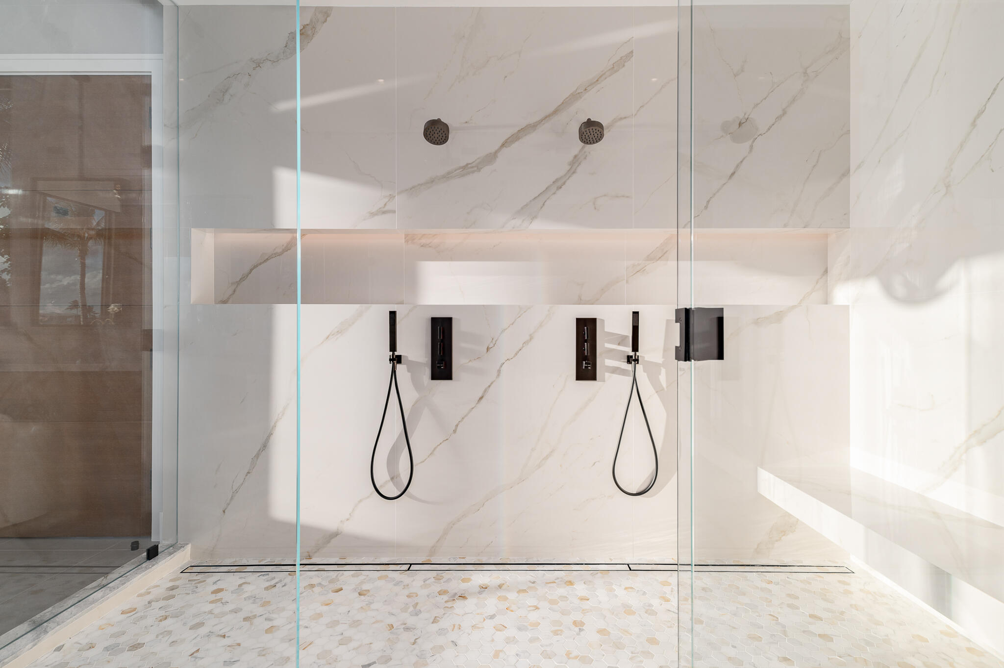 488 South Beach Road Jupiter Island, FL 33455 - Photo 31 of 54 a bathroom with a glass shower