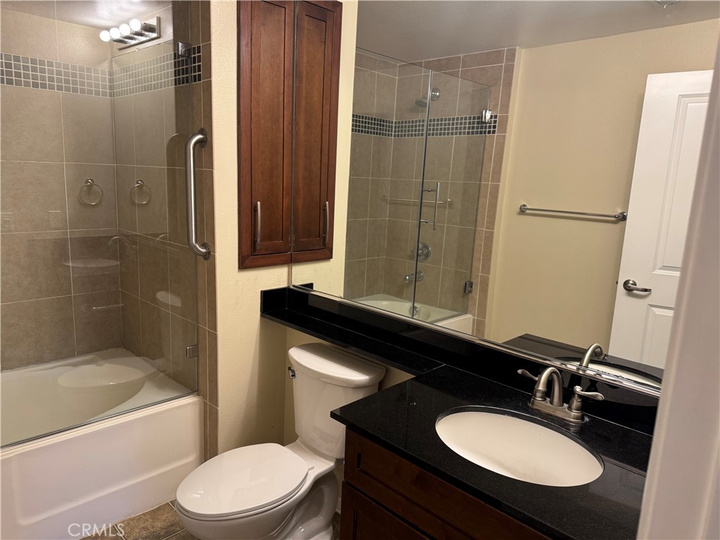 2414 Scholarship Irvine, CA 92612 - Photo 11 of 20 a bathroom with a sink toilet a mirror and shower