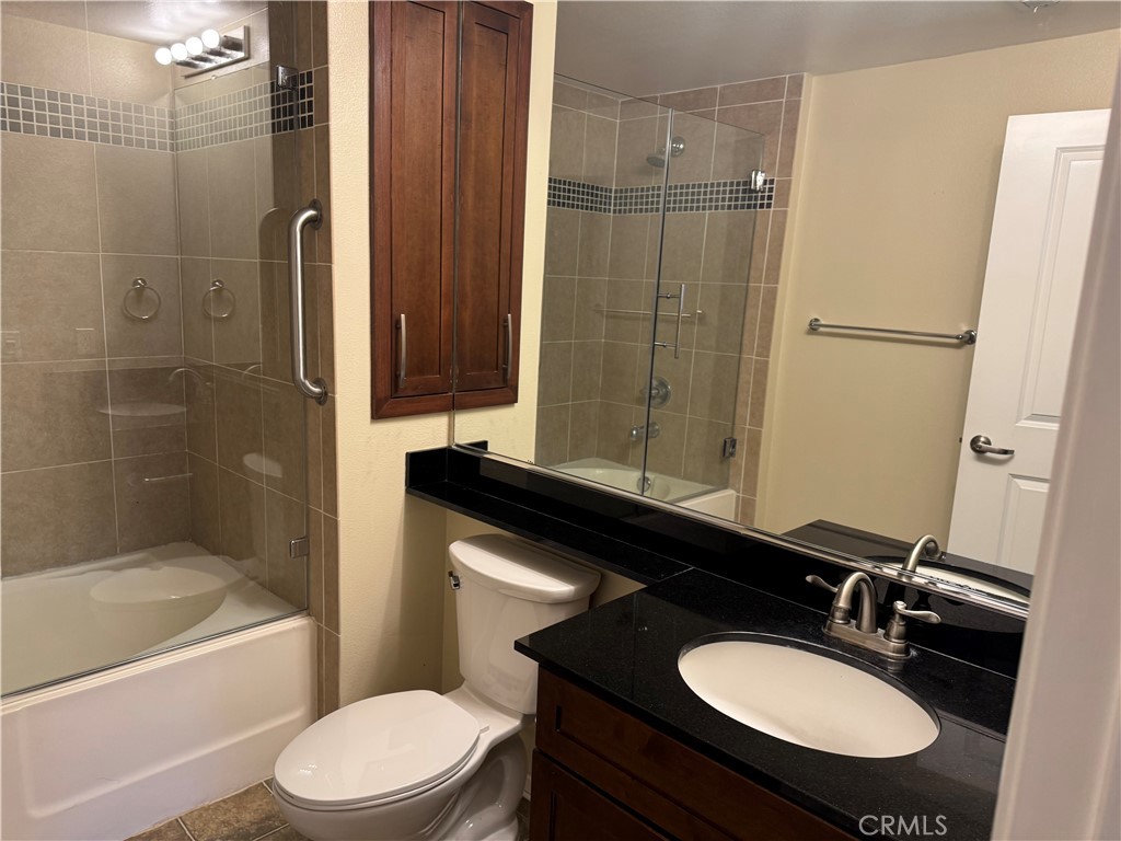 2414 Scholarship Irvine, CA 92612 - Photo 12 of 20 a bathroom with a sink toilet a mirror and shower