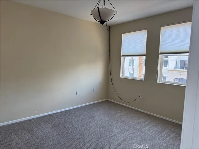 a view of an empty room with windows
