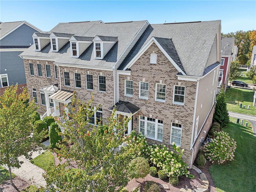 228 Venango Trail Mars, PA 16046 - Photo 1 of 41 a aerial view of a house with a yard and potted plants