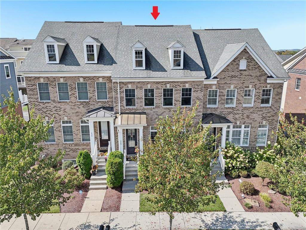 228 Venango Trail Mars, PA 16046 - Photo 2 of 41 a aerial view of a brick house with plants