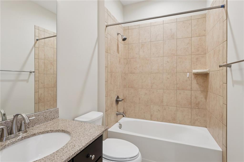 228 Venango Trail Mars, PA 16046 - Photo 26 of 41 a bathroom with a granite countertop sink toilet and shower