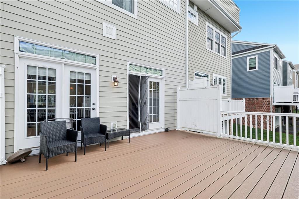 228 Venango Trail Mars, PA 16046 - Photo 27 of 41 a view of a deck with table and chairs and wooden floor