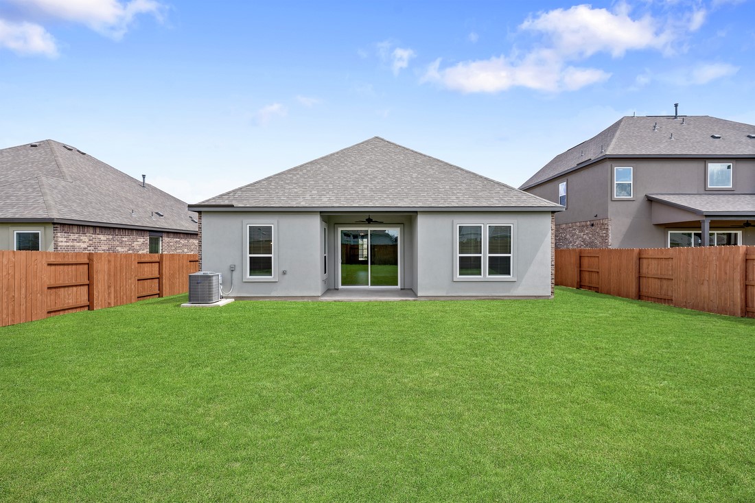 116 Nandina Path Bastrop, TX 78602 - Photo 4 of 11 a front view of a house with yard