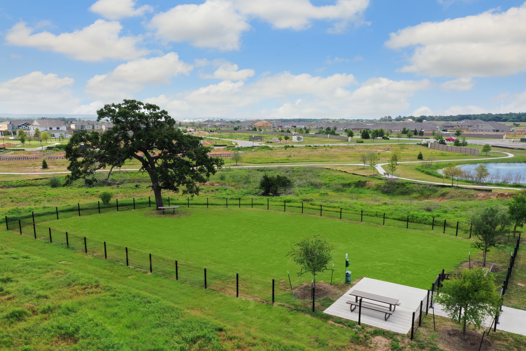 116 Nandina Path Bastrop, TX 78602 - Photo 5 of 11 a view of a lake with a building in the background