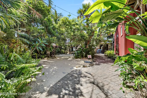 a swimming pool with outdoor seating and plants