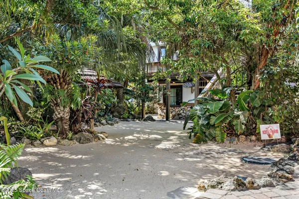 a view of an chairs and table in the balcony