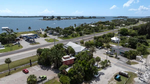 an aerial view of a city with lawn chairs