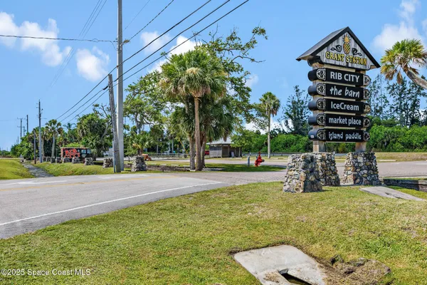 a view of outdoor space with garden and trees