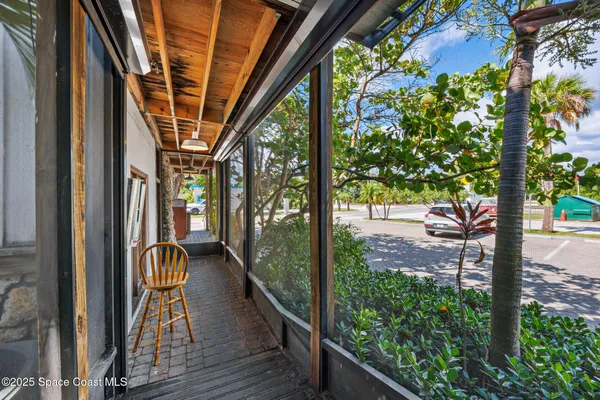 a room with lots of wooden furniture and a window