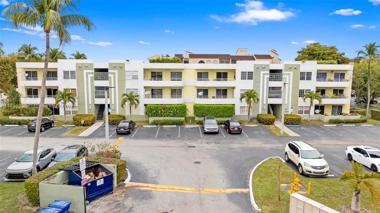 a couple of cars parked in front of a building
