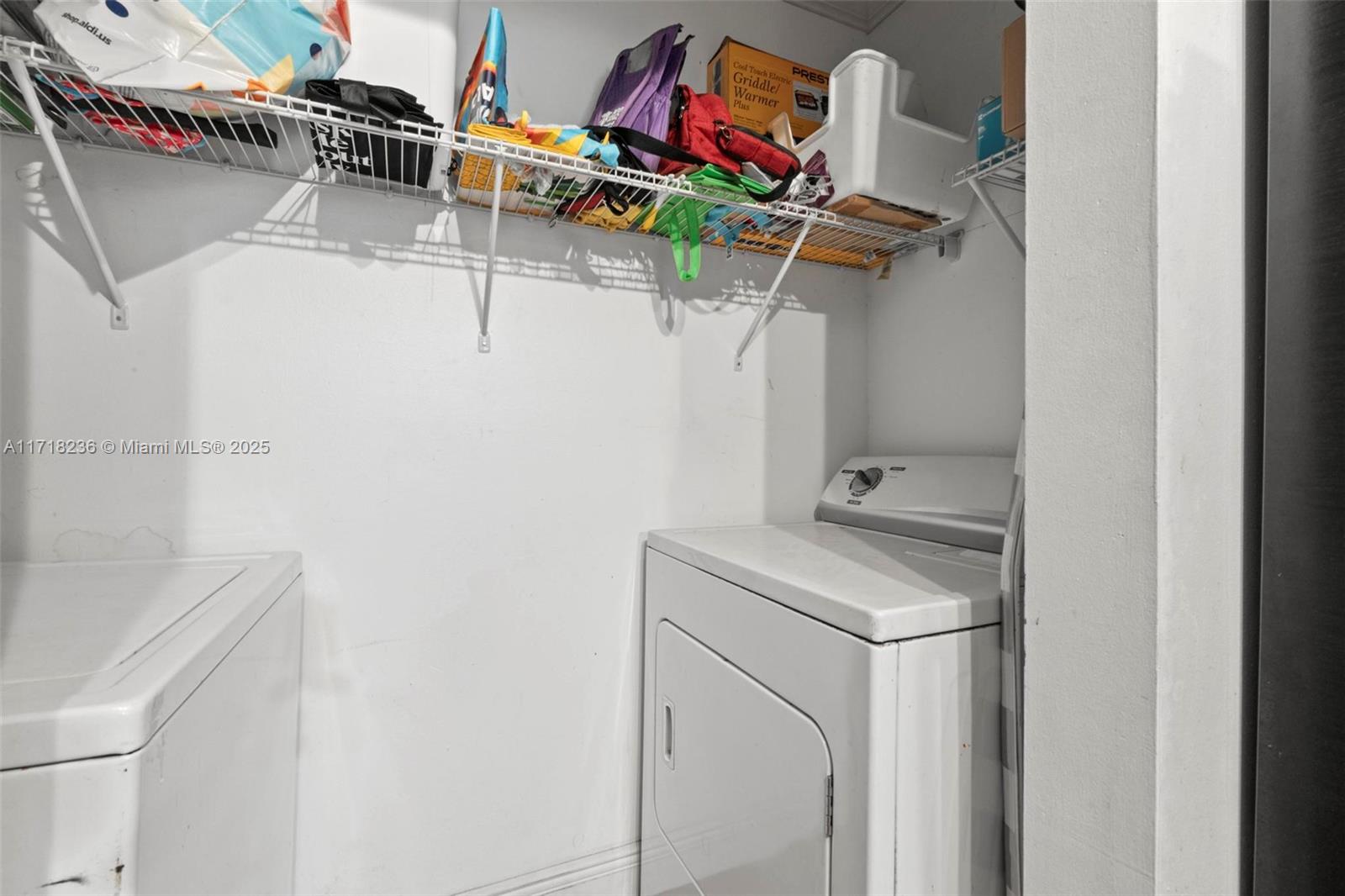 10755 Southwest 108th Avenue, Unit 301 Miami, FL 33176 - Photo 20 of 23 a utility room with dryer and washer