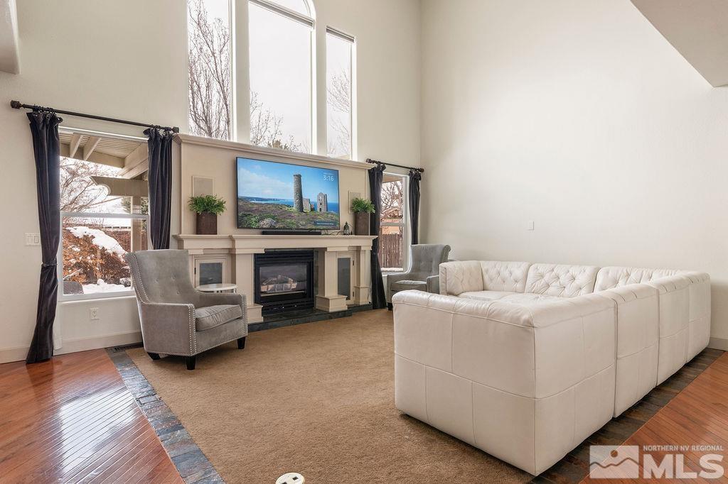 9985 Moccasin Court Reno, NV 89521 - Photo 14 of 40 a living room with furniture and a fireplace