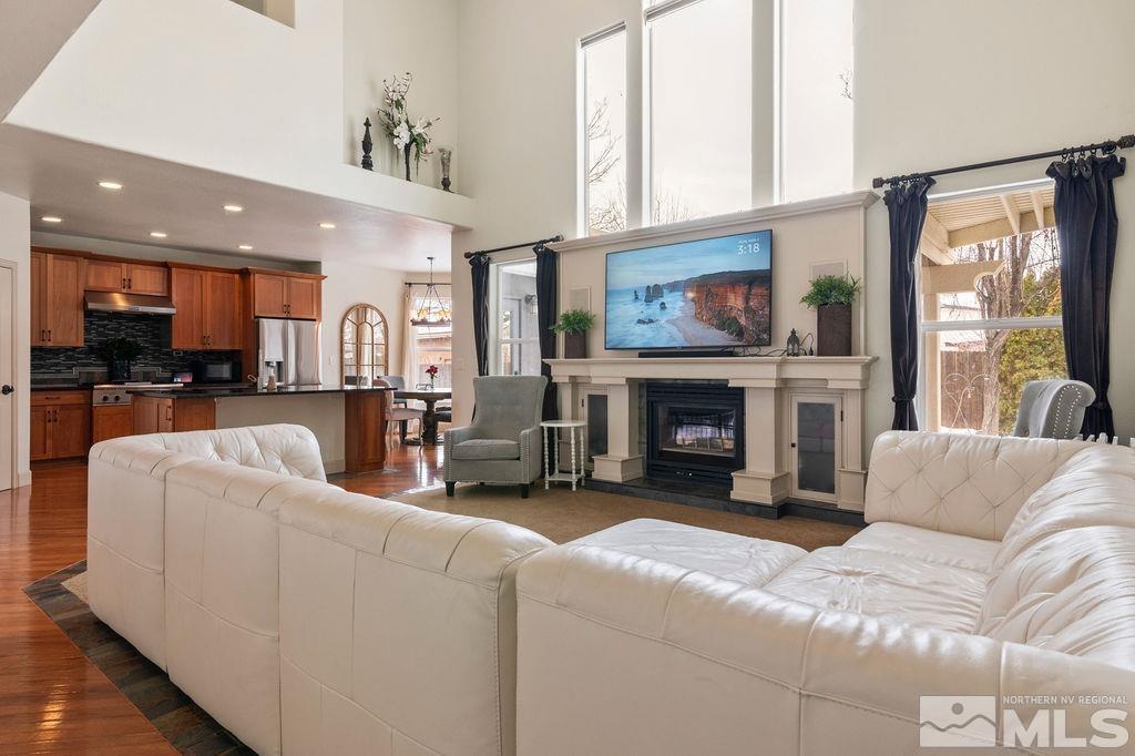 9985 Moccasin Court Reno, NV 89521 - Photo 16 of 40 a living room with furniture and a fireplace