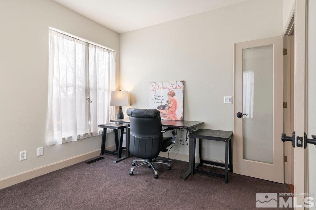 9985 Moccasin Court Reno, NV 89521 - Photo 20 of 40 a view of a workspace with furniture and a window