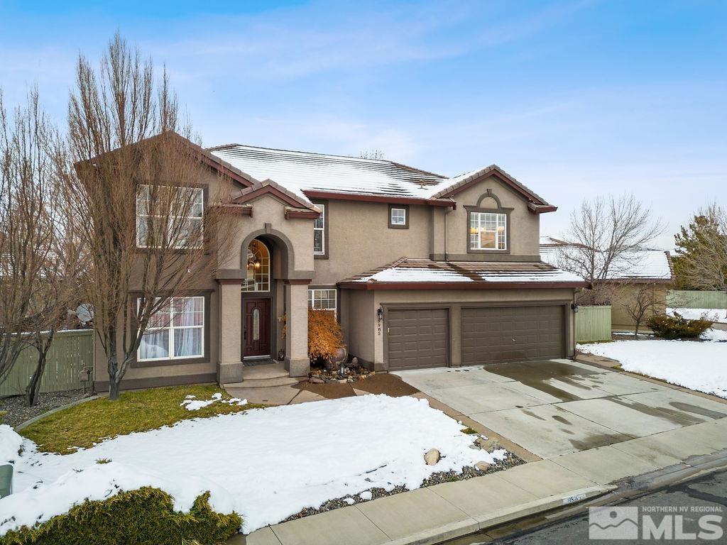 9985 Moccasin Court Reno, NV 89521 - Photo 2 of 40 a front view of a house with a yard