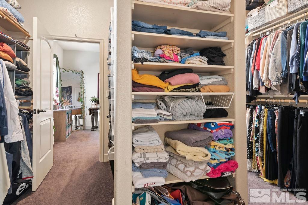 9985 Moccasin Court Reno, NV 89521 - Photo 37 of 40 a view of walk in closet with clothes and shoes