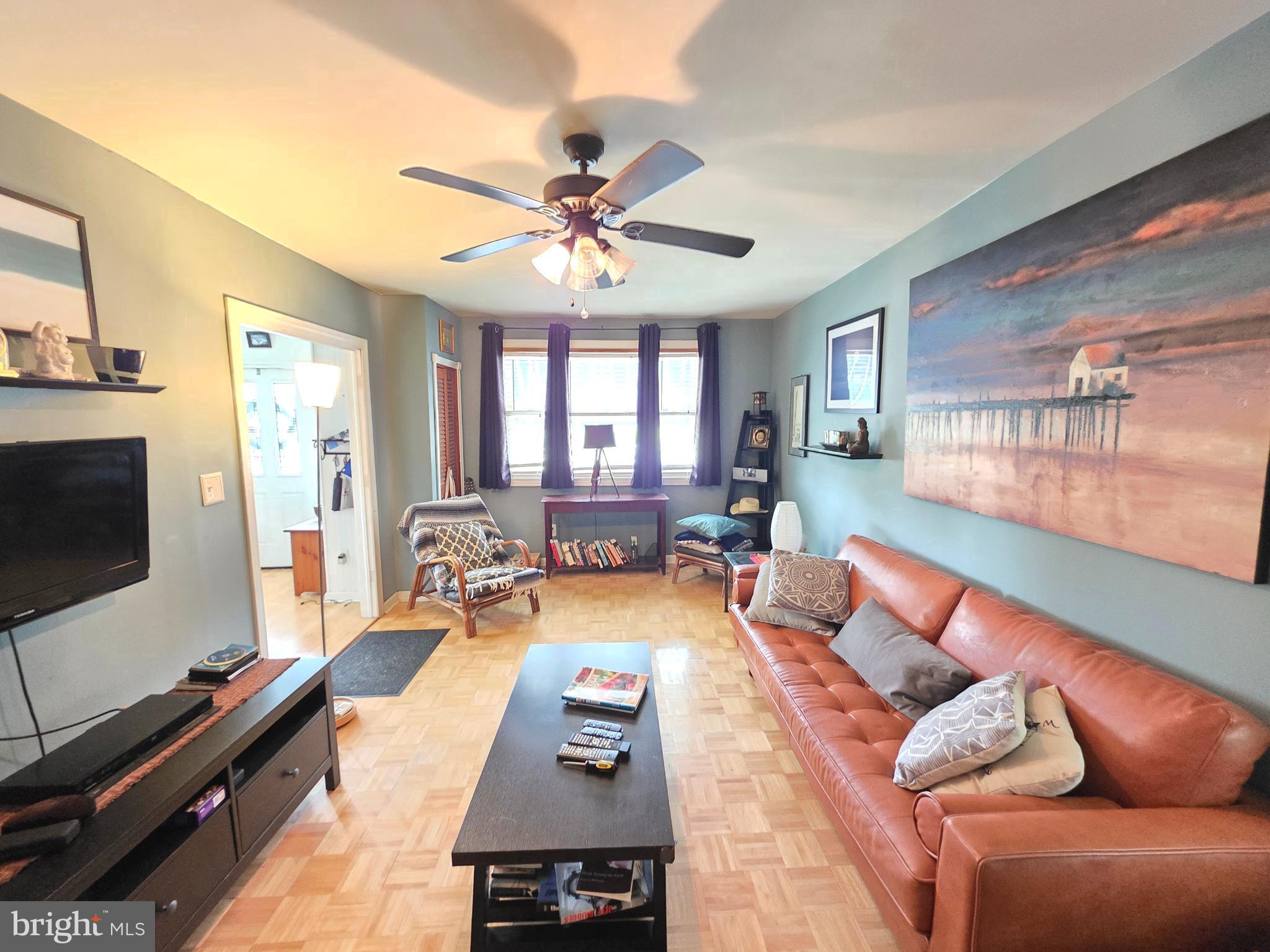 53 Valley Road Mount Ephraim, NJ 08059 - Photo 11 of 21 a living room with furniture and a flat screen tv