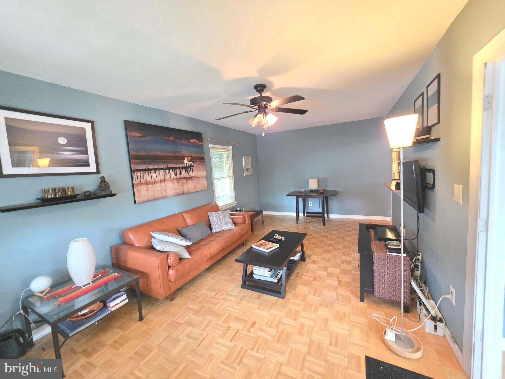 53 Valley Road Mount Ephraim, NJ 08059 - Photo 12 of 21 a living room with furniture a chandelier and a flat screen tv