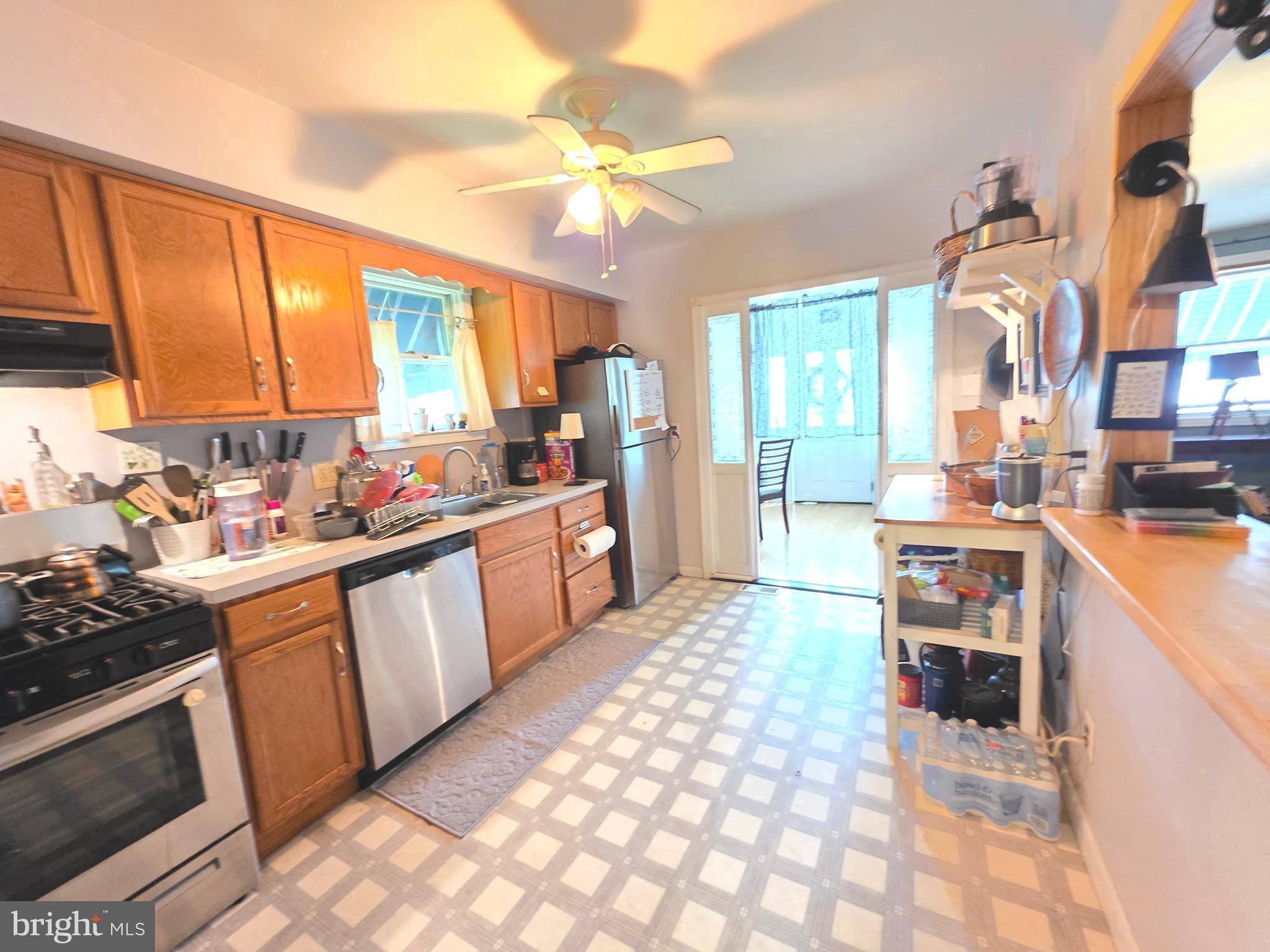 53 Valley Road Mount Ephraim, NJ 08059 - Photo 14 of 21 a kitchen with stainless steel appliances granite countertop a stove a sink dishwasher and a microwave oven with white cabinets