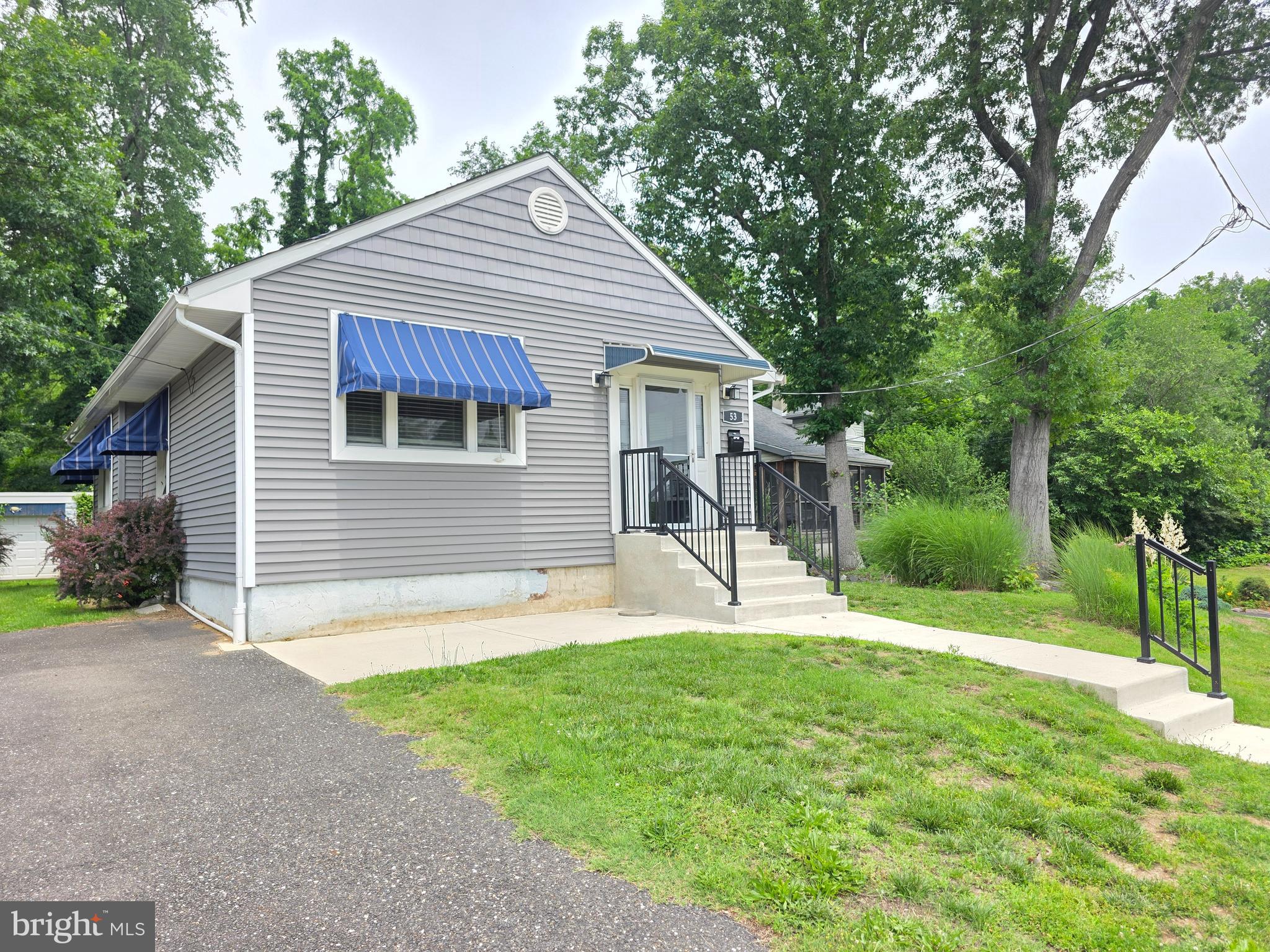 53 Valley Road Mount Ephraim, NJ 08059 - Photo 3 of 21 a front view of house with a garden and trees