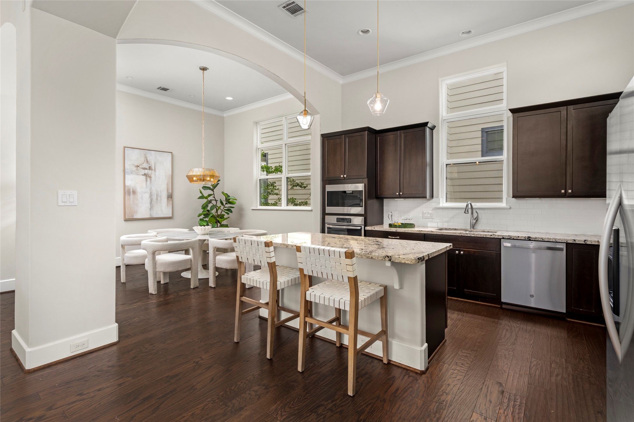 5646 Larkin Street Houston, TX 77007 - Photo 29 of 29 Columns and archways subtly define the open floor plan while adding an architectural touch.