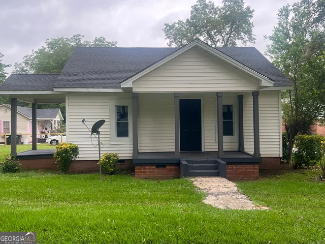 front view of a house with a yard