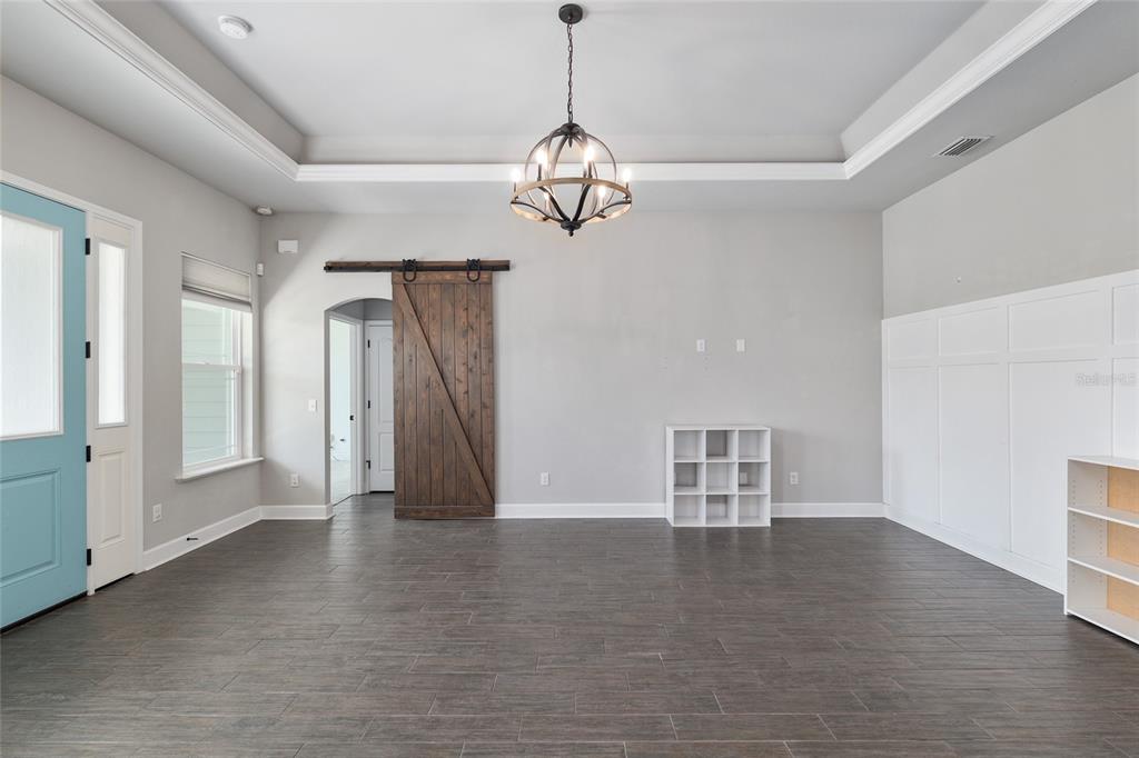 2556 Southwest 118th Terrace Gainesville, FL 32608 - Photo 12 of 72 a view of a livingroom with wooden floor