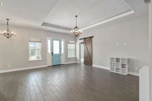 a view of a kitchen with a dishwasher cabinets and a floor to ceiling window