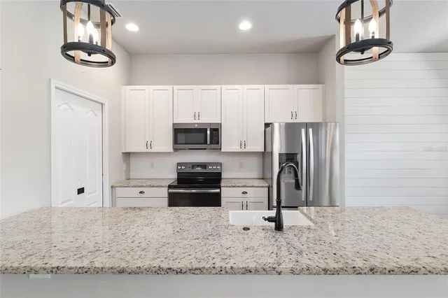 a kitchen with sink and window