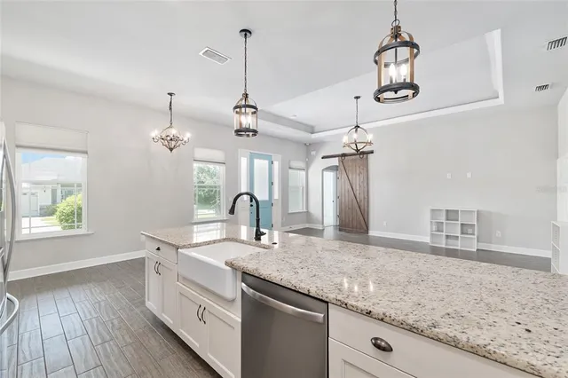 a view of a kitchen with a sink and dishwasher