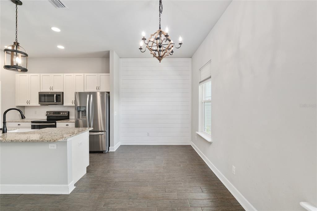 2556 Southwest 118th Terrace Gainesville, FL 32608 - Photo 26 of 72 a view of a kitchen with a sink and dishwasher