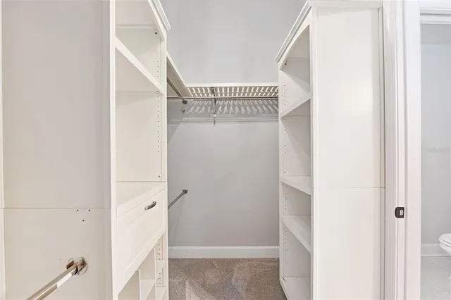 a room that has a bed and a chair in it