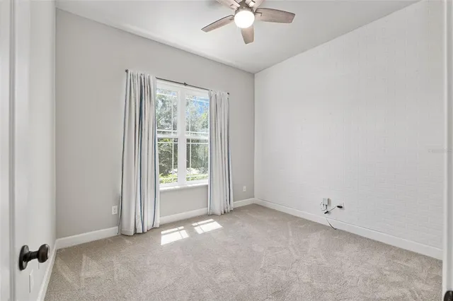 a view of a porch with a table and chairs