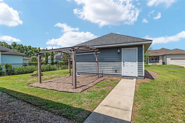 a view of a backyard with sitting area