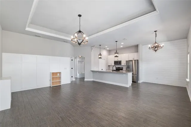 a view of a livingroom with wooden floor