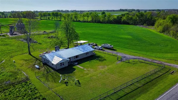 an aerial view of a golf course with chairs
