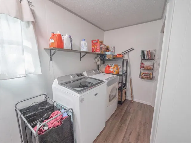 a utility room with sink dryer and washer